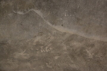 fondo abstracto con manchas grises sobre suelo de cemento