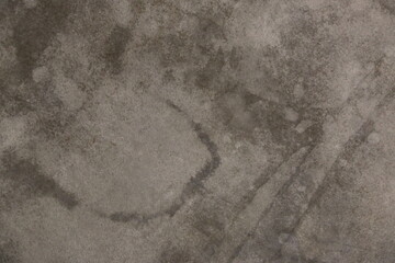 fondo abstracto con manchas grises sobre suelo de cemento