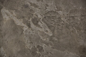 fondo abstracto con manchas grises sobre suelo de cemento