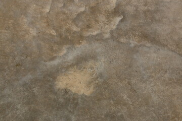 fondo abstracto con manchas grises sobre suelo de cemento