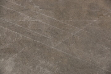 fondo abstracto con manchas grises sobre suelo de cemento