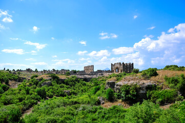 Fototapeta na wymiar View of the basilica ruins in ancient Greco-Roman city Aspendos near Antalya, Turkey