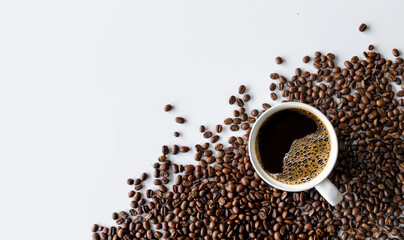 cup of coffee and bean on white table background. top view