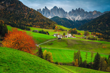 Picturesque alpine autumn landscape with Santa Maddalena village, Dolomites, Italy