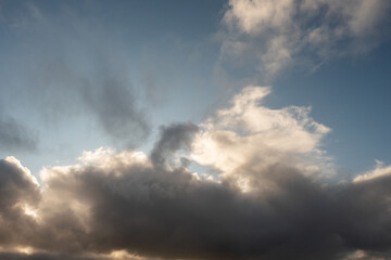 Naklejka na ściany i meble Dramatic clouds in a blue sky.
