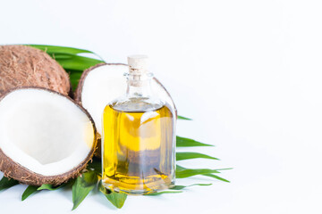 Ripe half cut coconut on a wooden background. Coconut cream and oil.