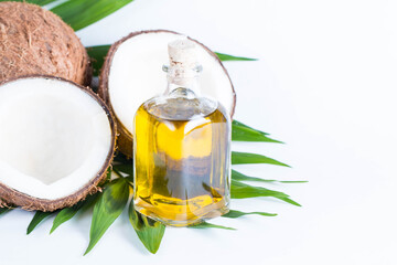 Ripe half cut coconut on a wooden background. Coconut cream and oil.