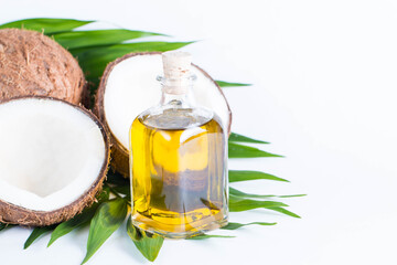 Ripe half cut coconut on a wooden background. Coconut cream and oil.