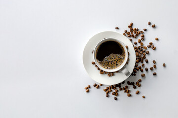 cup of coffee and bean on white table background. top view