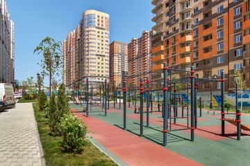The courtyard of a modern residential building with equipments for workout and fitness outdoor activities