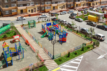 Fototapeta na wymiar The new modern children's playground in the courtyard of a multistory residential building. Rostov-on-Don / Russia - 07 may 2019