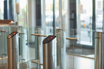 Background of glass doors with automated gate at entrance to office building or college, copy space