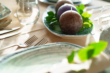 Luxury green table setting decorated with candles