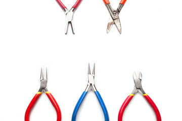 Different goldsmiths tools on the jewelry workplace. Desktop for craft jewelry making with...