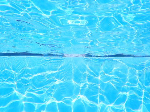 Swimming Pool Underwater Background. Chlorine Water Treatment And  Sanitation. Empty Copy Space With No People For Editor's Text.