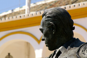 Seville (Spain). Close-up of the sculpture of the bullfighter Curro Romero next to the bullring of...