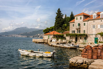 Fototapeta na wymiar Roof tiles piled on the quayside in the charming fishing village of Rose, Luštica, Montenegro