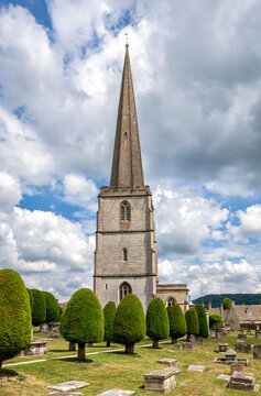The Church of St Mary in the Cotswold town of Painswick, England, United Kingdom. The church is famous for its 99 yew trees. Parts of the building date from the 14th Century.