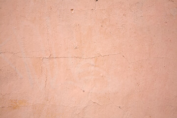 Old grunge crack pink concrete wall texture as background