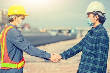 Two engineer shake hand success agreement construction project