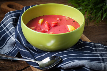 Vegetarian red soup - borsch in green bowl.