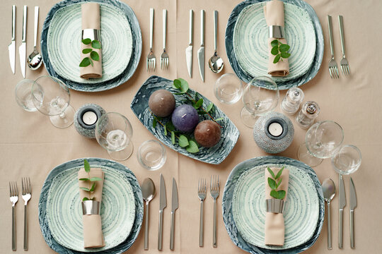 Luxury Green Table Setting Decorated With Candles