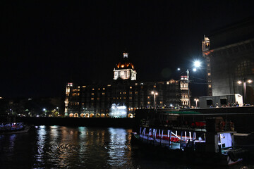 Fototapeta na wymiar beautiful water reflection of night life near mumbai port
