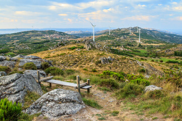 Beautiful landscape of Serra do Caramulo in Portugal, at sunset, with wooden bench in the...