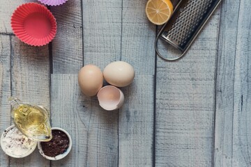 Cake baking ingredients on a wooden background, isolated , above vantage point photography