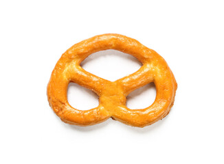 A single pretzel isolated on white background. Salty brown snack top view