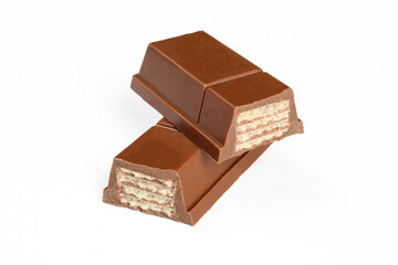 Chocolate covered wafer sweets. Two pieces of choco bar filled with crunchy layers isolated on white background