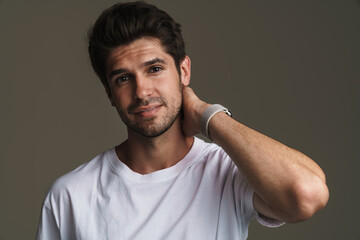 Portrait of confident young man posing and looking at camera