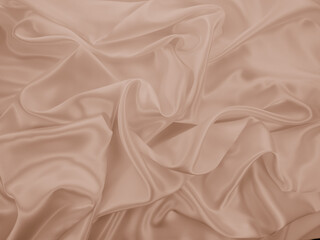 Obraz premium Photography of beautiful smooth elegant wavy beige / light brown satin silk luxury cloth fabric texture, abstract background design. Copy space. Card or banner