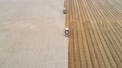 Fototapeta premium seeder sows in the field, North China