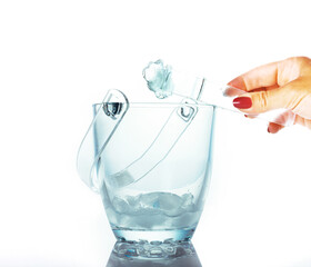 Ice for cocktail in a glass bucket isolated on white, summer concept, cooling drinks