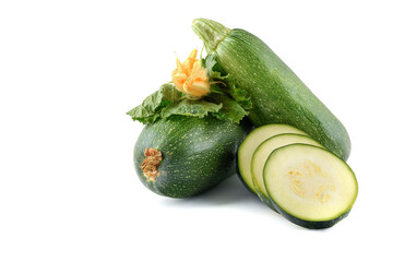 harvest of fresh courgettes with green leaves and flower, isolated on a white background