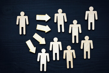 Assertiveness or leadership concept. Small figure, arrow and crowd.