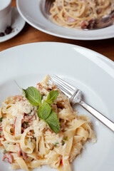 A plate of delicious pasta in Italian cafe, top view