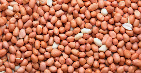 Top view of Raw Peanuts background. Pile of raw peanuts beans texture. 