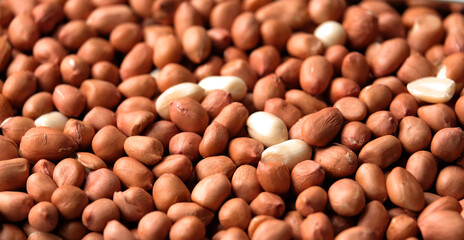 Close up of Raw Peanuts background. Pile of raw peanuts beans texture. 