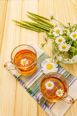 Chamomile tea. Fresh flowers, summer hot drink concept. Alternative medicine, lifestyle