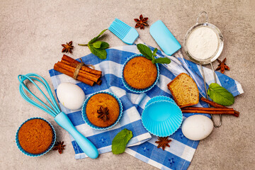 Homemade cupcakes with cinnamon, star anise and fresh mint. Bakery concept, set of ingredients for cooking
