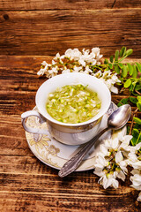 Tea from fresh acacia petals. Hot drink, alternative medicine