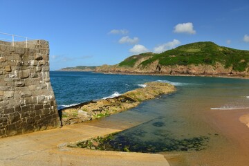 Greve De Lecq bay, Jersey, U.K. Natural coastline in the Summer and small fishing port.
