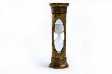 Vintage bronze hourglass on an isolated white background
