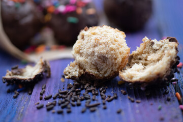 Chocolate donut holes with sprinkles close up