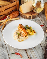 Gourmet dish grilled salmon steak potato gratin