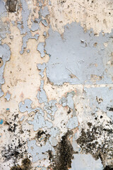 Old weathered wall with peeling paint