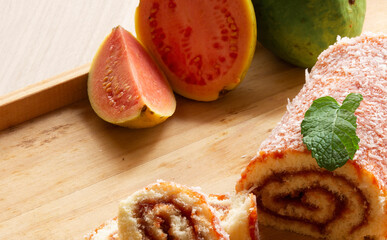 Bolo de Rolo (Swiss roll, Roll cake) typical Brazilian dessert, from the northeast region. Sliced ​​cake roll with guava paste.