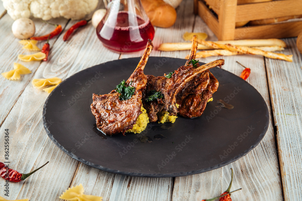 Wall mural Delicious rack of lamb with hummus sauce - Wall murals